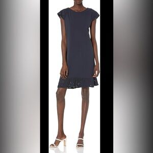 Tommy Hilfiger Navy dress with capped sleeves and bottom that is embroidered
